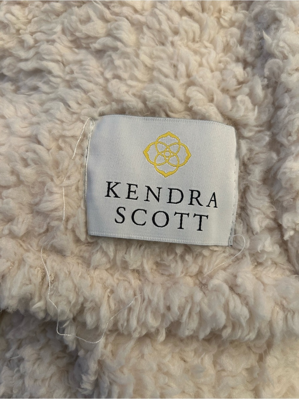 Kendra Scott Cream Plush Throw Blanket has wear needs wash
